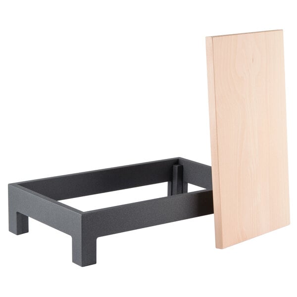 A wood and metal display table for Vollrath cutting boards.