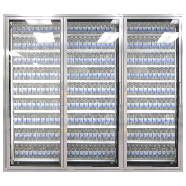 Styleline walk-in cooler merchandiser doors with shelving holding many bottles of water.