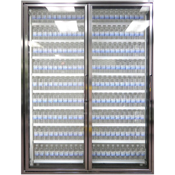 A Styleline walk-in freezer merchandiser with glass doors holding bottles of water.