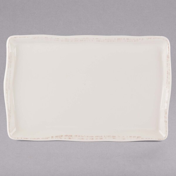 A white rectangular Libbey porcelain tray with a brown border.