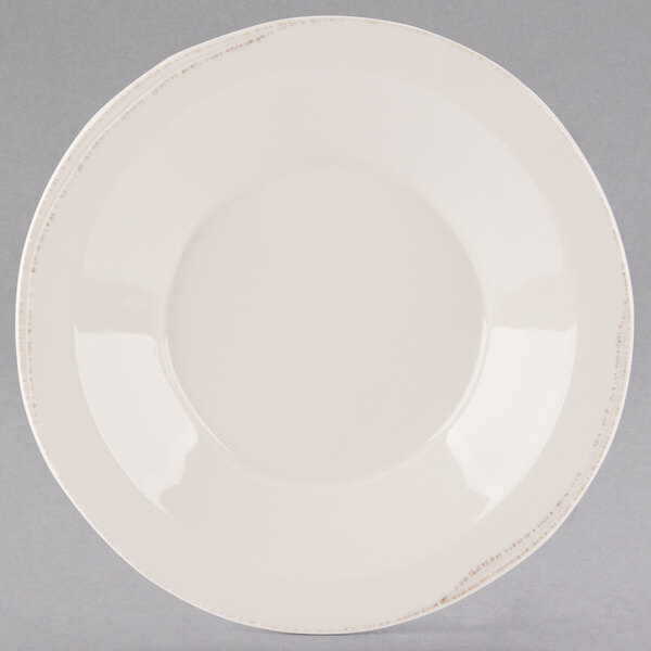 A Libbey round ivory porcelain pasta bowl with a rim.
