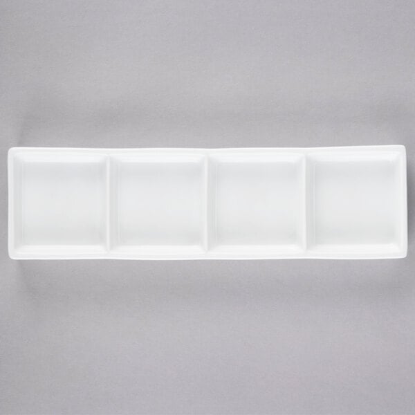 A white rectangular tray with four compartments.