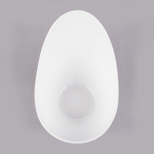 A white Libbey porcelain bowl with a hole in it.