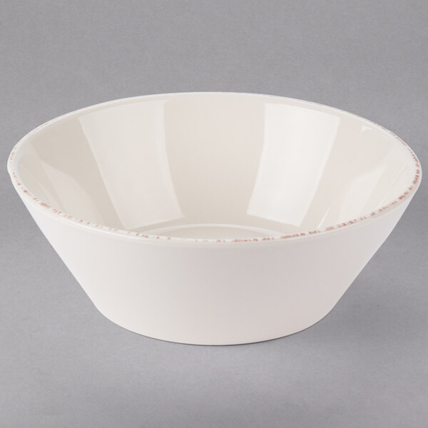 A Libbey ivory porcelain serving bowl with a rim.
