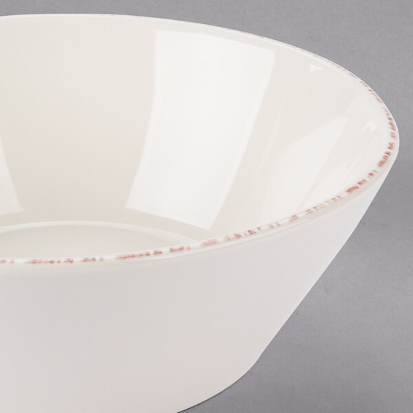 A white Libbey porcelain serving bowl with a brown rim.