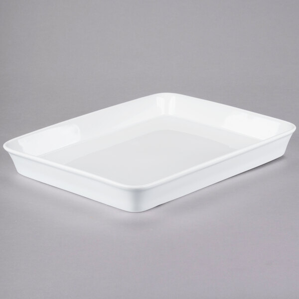 A white rectangular Libbey porcelain pan on a gray surface.