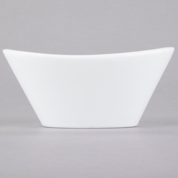 A Libbey Chef's Selection II white porcelain bowl with a small handle.