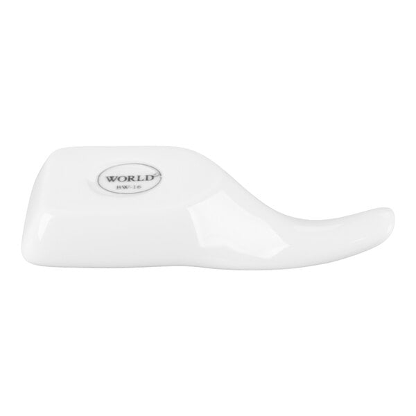 A white porcelain tasting spoon with a curved handle and a flat base.