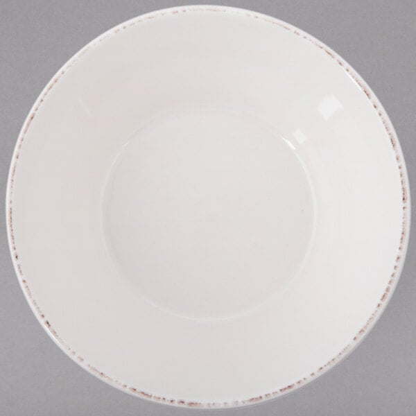 A white bowl with brown trim.