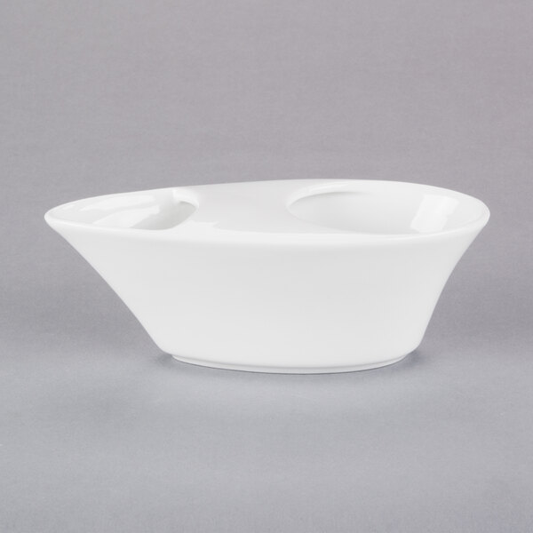 A Libbey white porcelain bar snack dispenser.