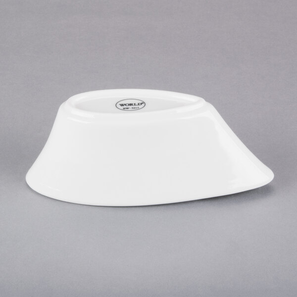 A Libbey white porcelain bar snack dispenser on a gray surface.