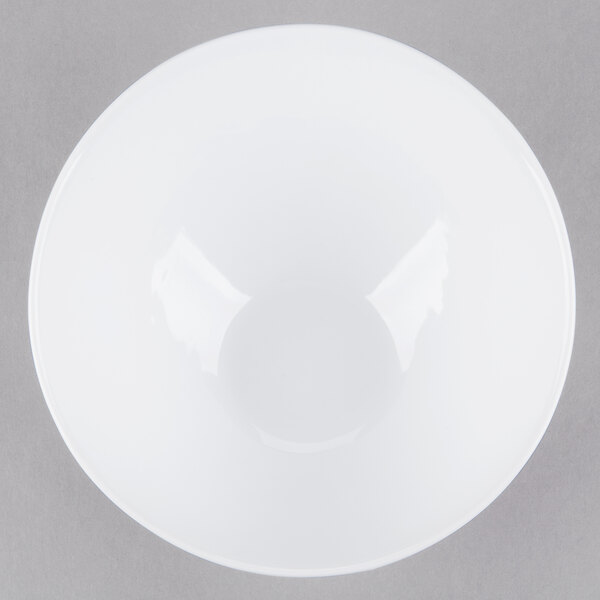 A Libbey Chef's Selection white porcelain bowl on a gray surface.