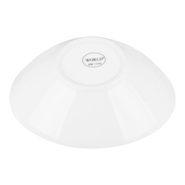 A white porcelain bowl shown upside down.