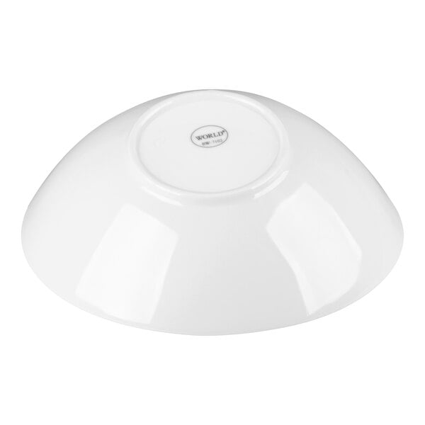 A white porcelain bowl shown upside down.