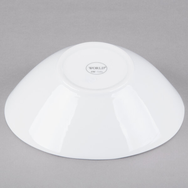 A Libbey white porcelain Belmar bowl on a gray surface.