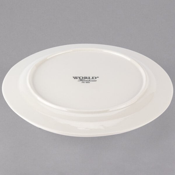 A white Libbey Farmhouse porcelain plate with a medium ivory rim.