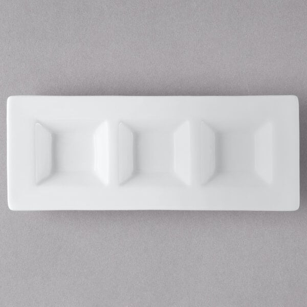 A white rectangular porcelain tray with three rectangular wells.