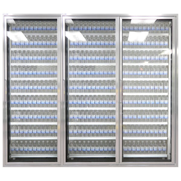 A Styleline walk-in freezer merchandiser with shelves of water bottles.