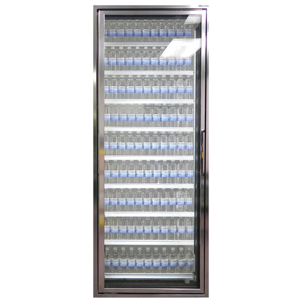 A Styleline walk-in freezer merchandiser door with shelves holding water bottles.