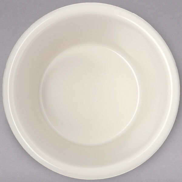 A white fluted ramekin with a circular shape.
