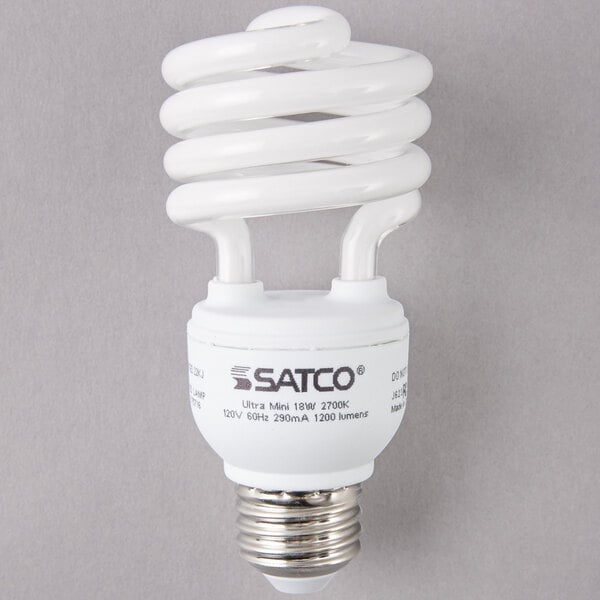 A close-up of a white Satco mini spiral compact fluorescent light bulb.