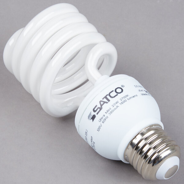 A close-up of a Satco spiral light bulb.