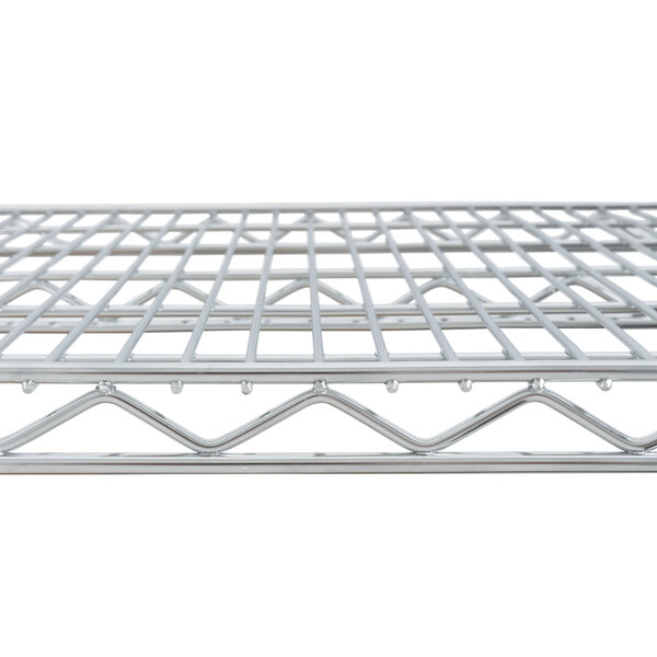 A Metro Super Erecta chrome wire shelf with a grid on top.