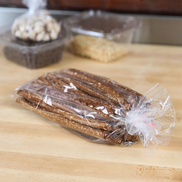 A plastic bag of pretzels on a table.