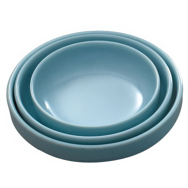 Three Thunder Group Blue Jade melamine bowls stacked on top of each other.