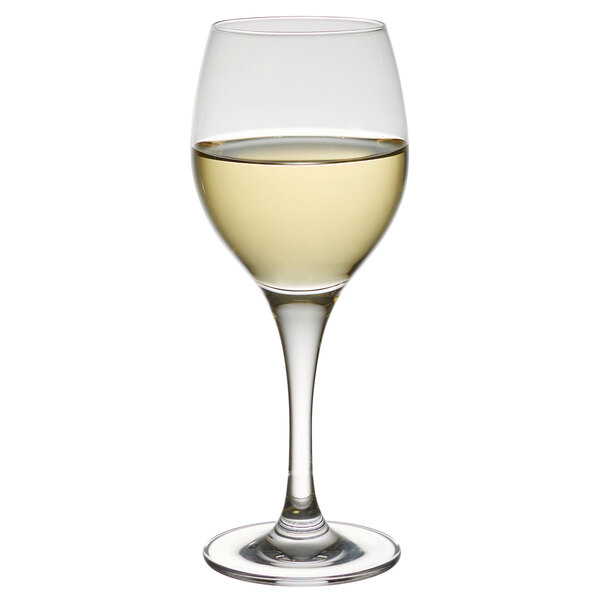A close-up of a Stolzle Nadine dessert wine glass filled with white wine.
