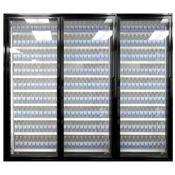 A Styleline walk-in freezer merchandiser door with shelves holding water bottles.