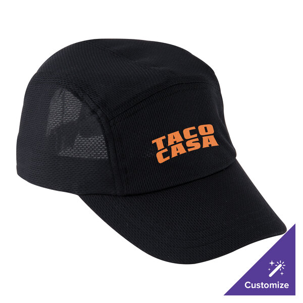 A black Headsweats 5-panel cap with orange text that says "Taco Casa" on the counter of a Mexican restaurant.