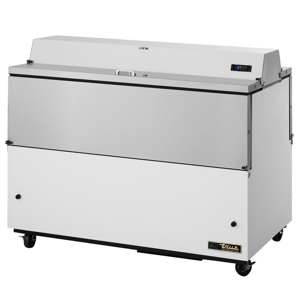 A True milk cooler with white and stainless steel exterior and wheels.