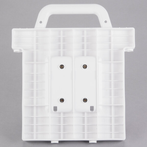 A white rectangular plastic object with two holes.