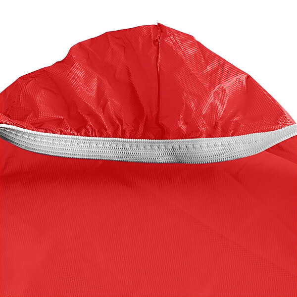 A Creative Converting rectangular tablecloth in red with elastic edges.