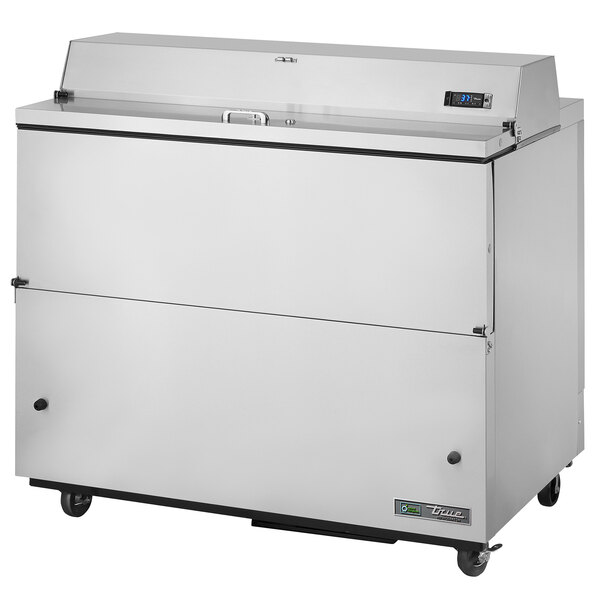 A True milk cooler with stainless steel exterior and interior on wheels.