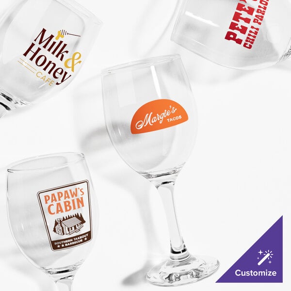 A group of Acopa customizable wine glasses with custom labels.