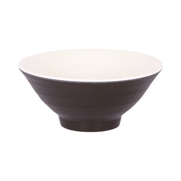 An Elite Global Solutions Durango melamine bowl with a white background and white rim with a chocolate brown interior.