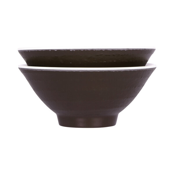 An antique white and chocolate brown melamine bowl with a white rim.