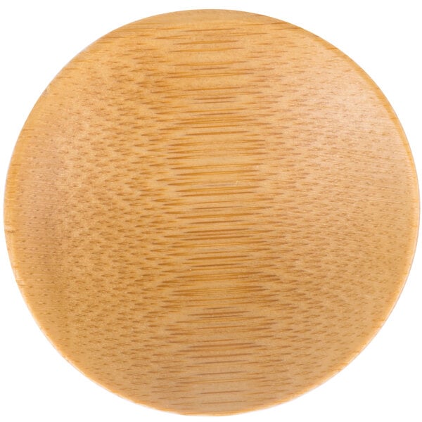 A Tablecraft bamboo round dish on a table.