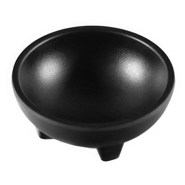 A black Elite Global Solutions molcajete bowl with legs on a white background.