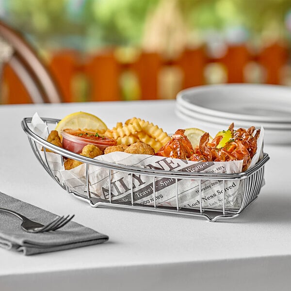 A Clipper Mill stainless steel boat basket of food on a table.