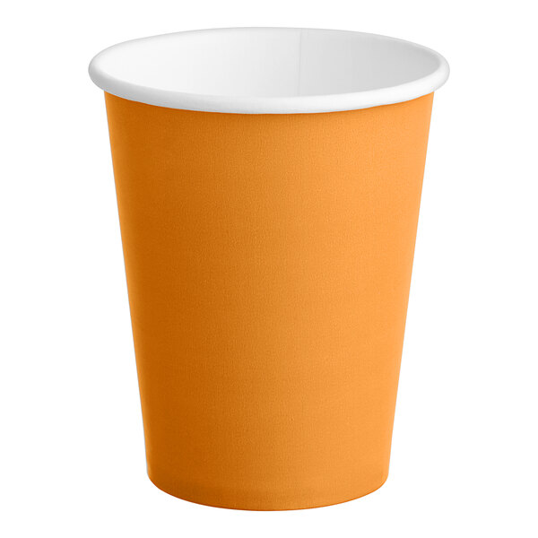 A close up of a Creative Converting pumpkin spice orange paper cup with a white rim.