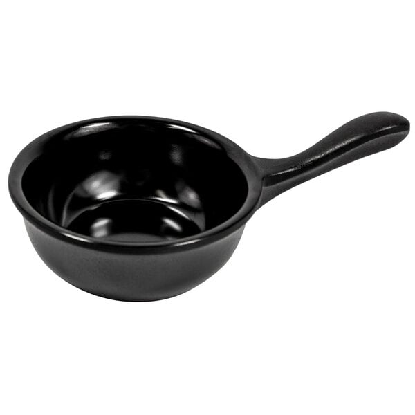 A black pan with a handle.