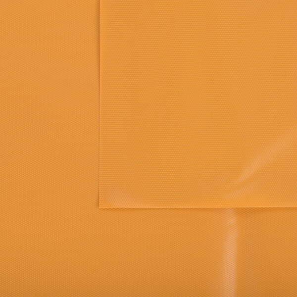 A yellow plastic table cover with a pumpkin design.