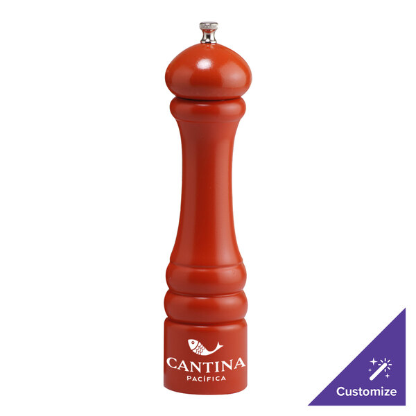 A red Chef Specialties pepper mill with a white logo on the side.