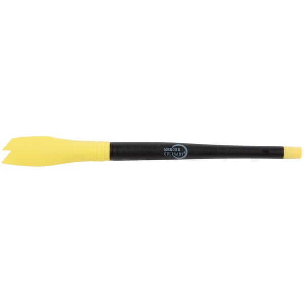 A yellow and black silicone brush with saw tooth edges on the tip.