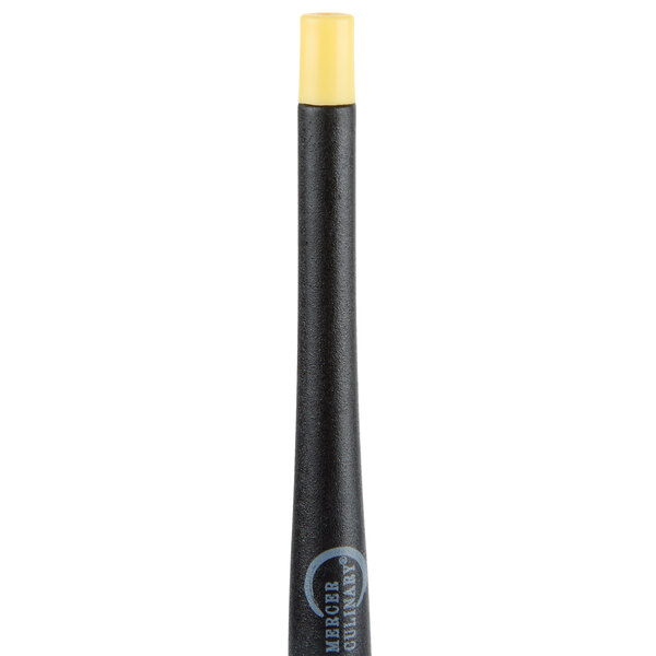 A black and yellow silicone plating tool with a black tip.