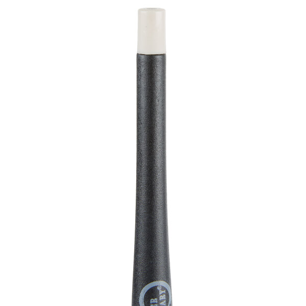 A black and white silicone brush with a white tip.