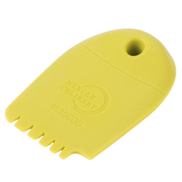 A yellow plastic Mercer Culinary wedge plating tool with numbers on it.
